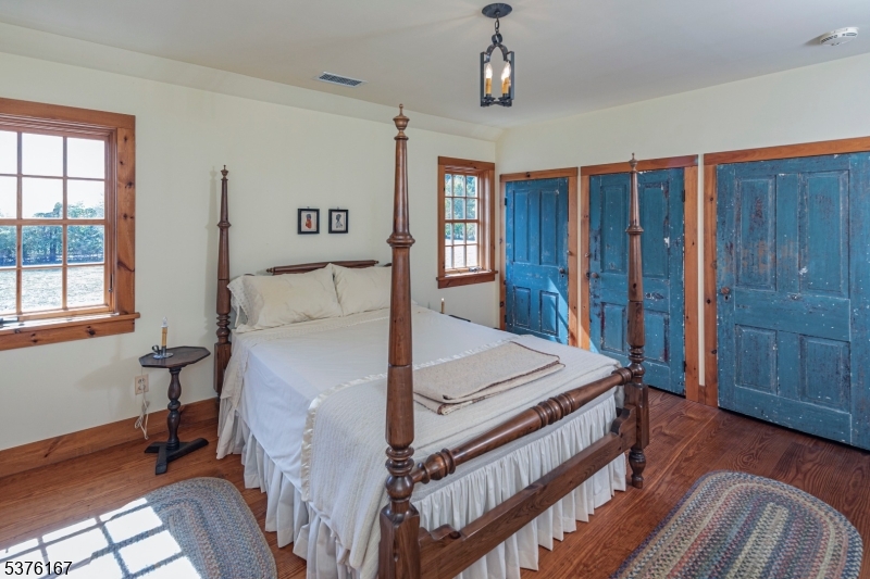 348 Rosemont Ringoes Road Stockton, NJ 08559 - Photo 30 of 42 a bed room with a bed and a dresser