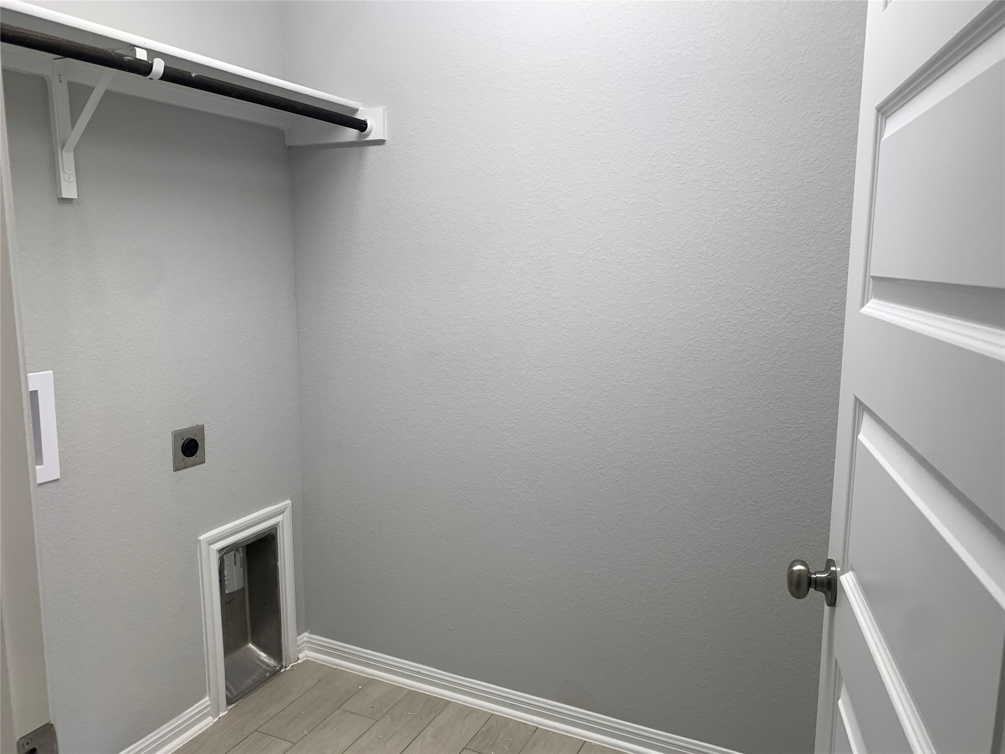2948 Sage Ranch Drive Leander, TX 78641 - Photo 9 of 28 A dedicated utility space with hookups and shelving ensures practical convenience.