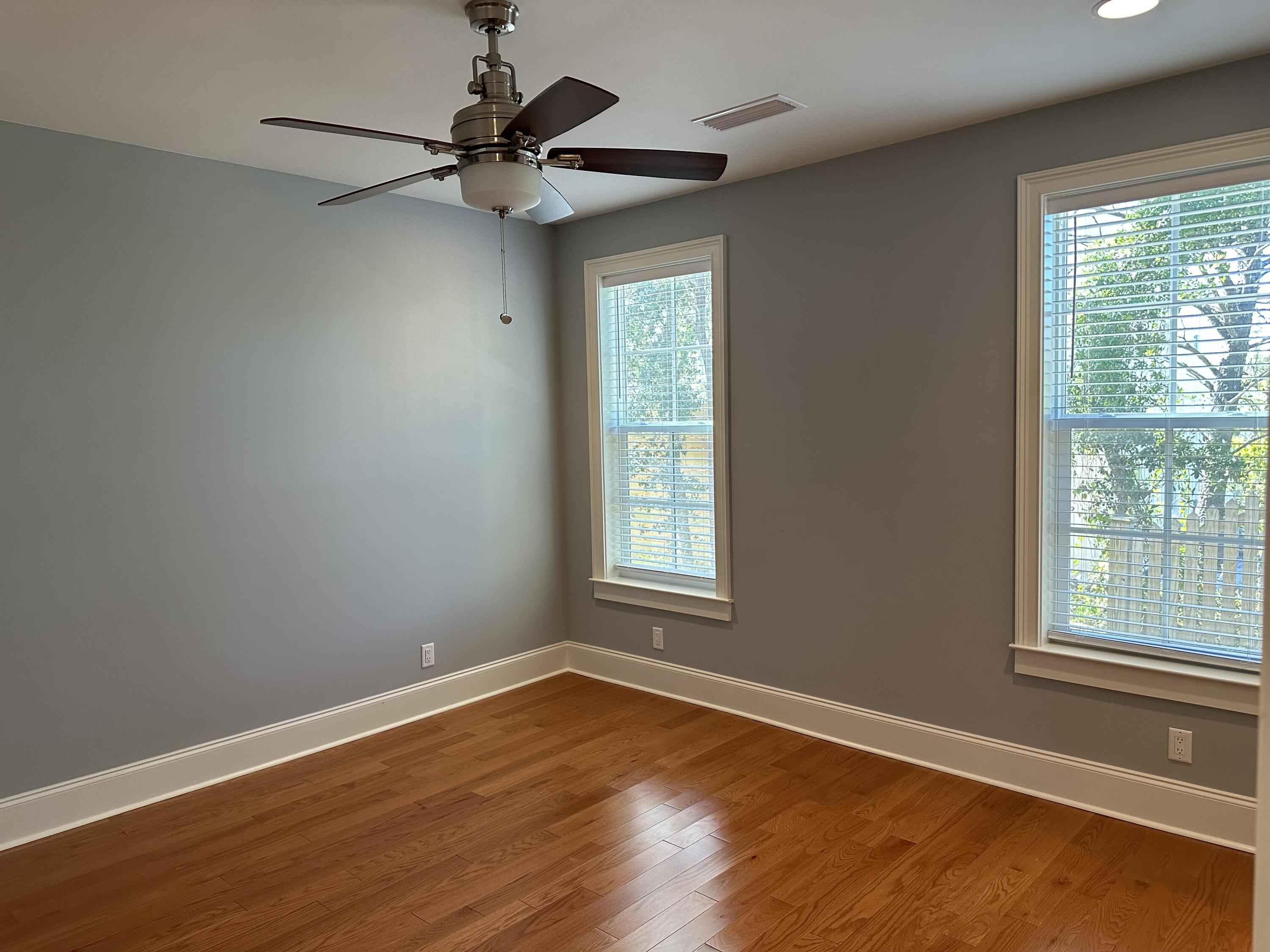 28 Maritime Way Santa Rosa Beach, FL 32459 - Photo 16 of 25 a view of an empty room with wooden floor and a window