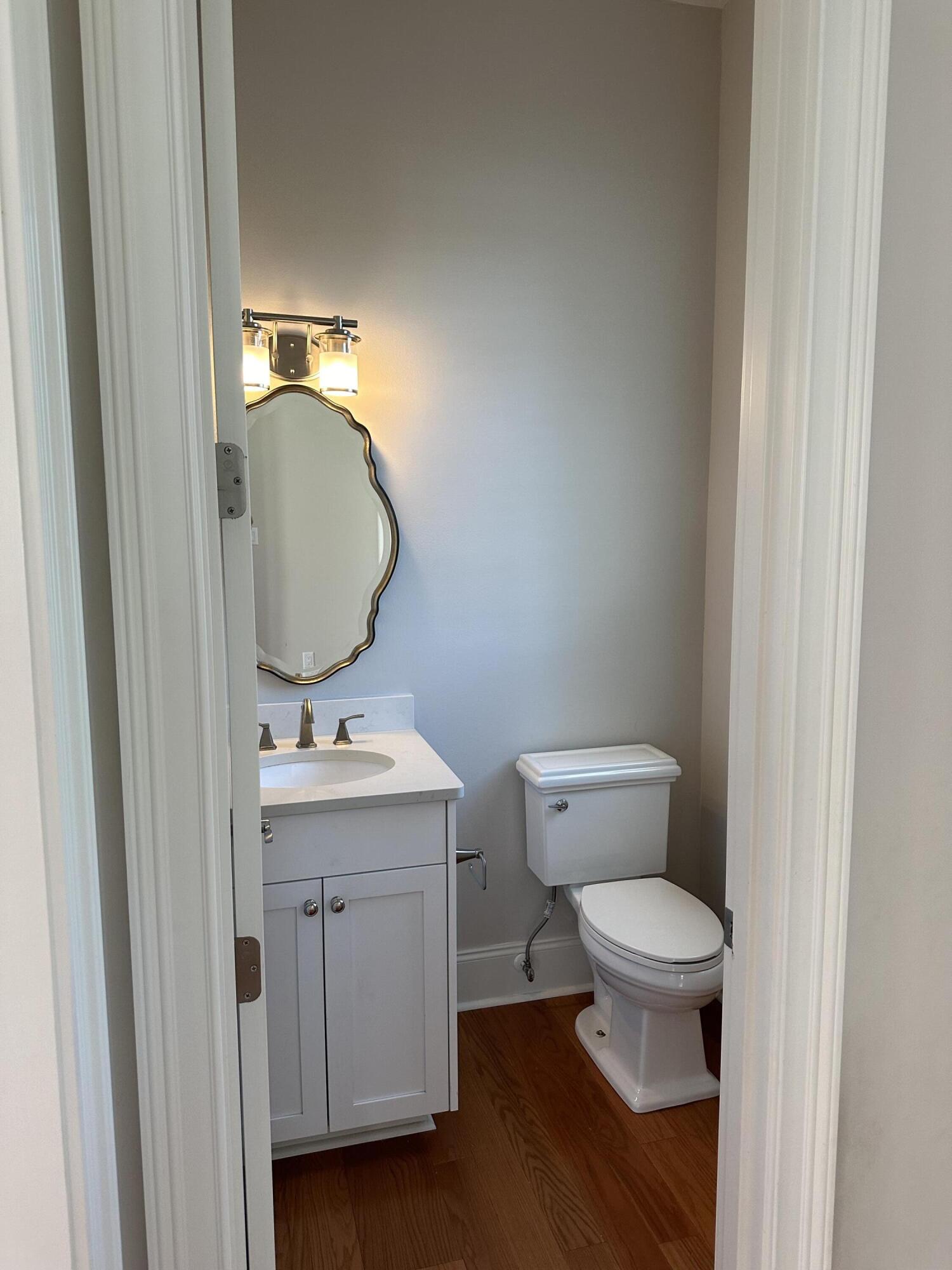 28 Maritime Way Santa Rosa Beach, FL 32459 - Photo 17 of 25 a bathroom with a toilet a sink and mirror