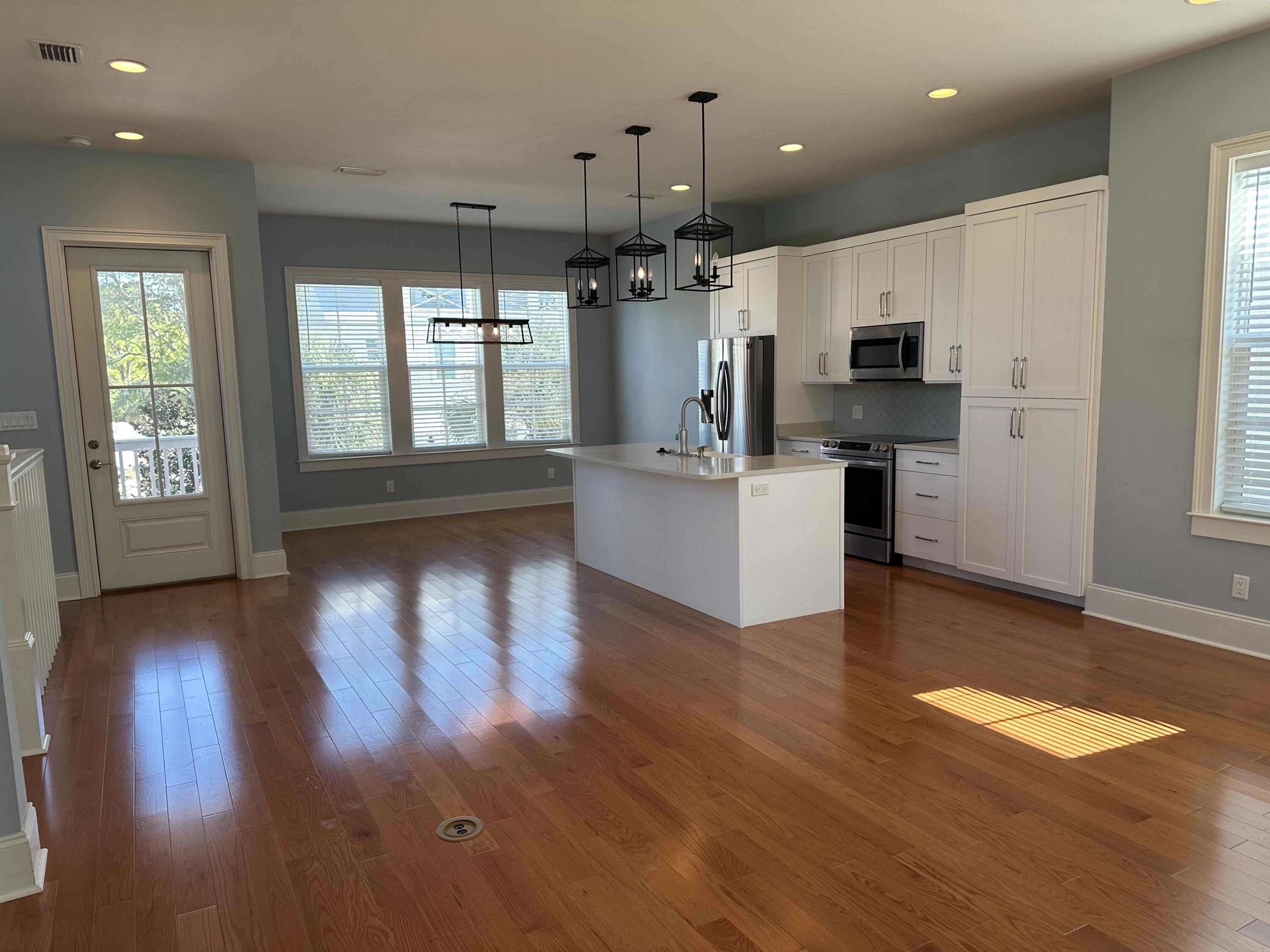 28 Maritime Way Santa Rosa Beach, FL 32459 - Photo 2 of 25 a kitchen with stainless steel appliances granite countertop a refrigerator a sink dishwasher a stove and a wooden floors