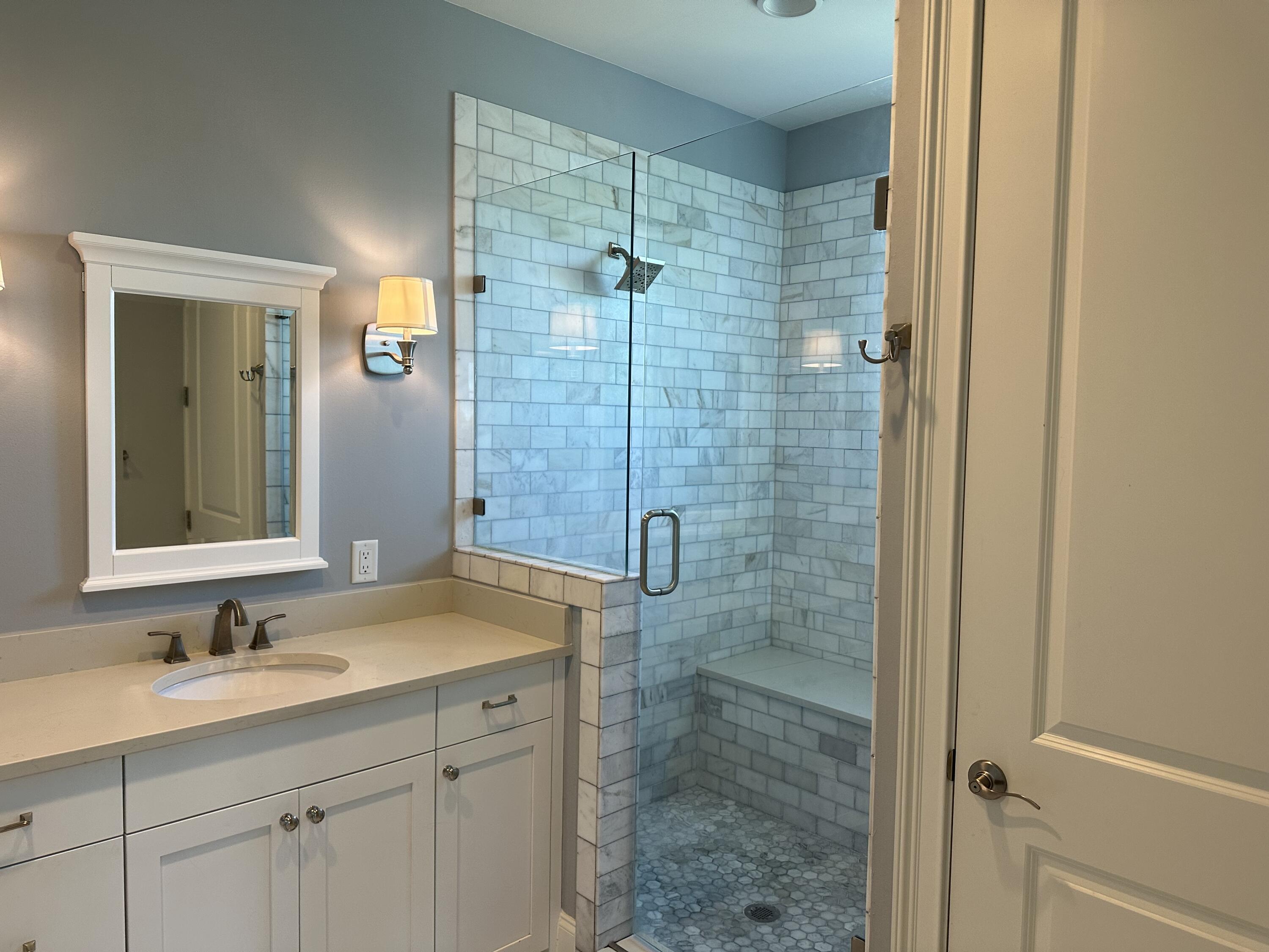 28 Maritime Way Santa Rosa Beach, FL 32459 - Photo 21 of 25 a bathroom with a shower sink and mirror
