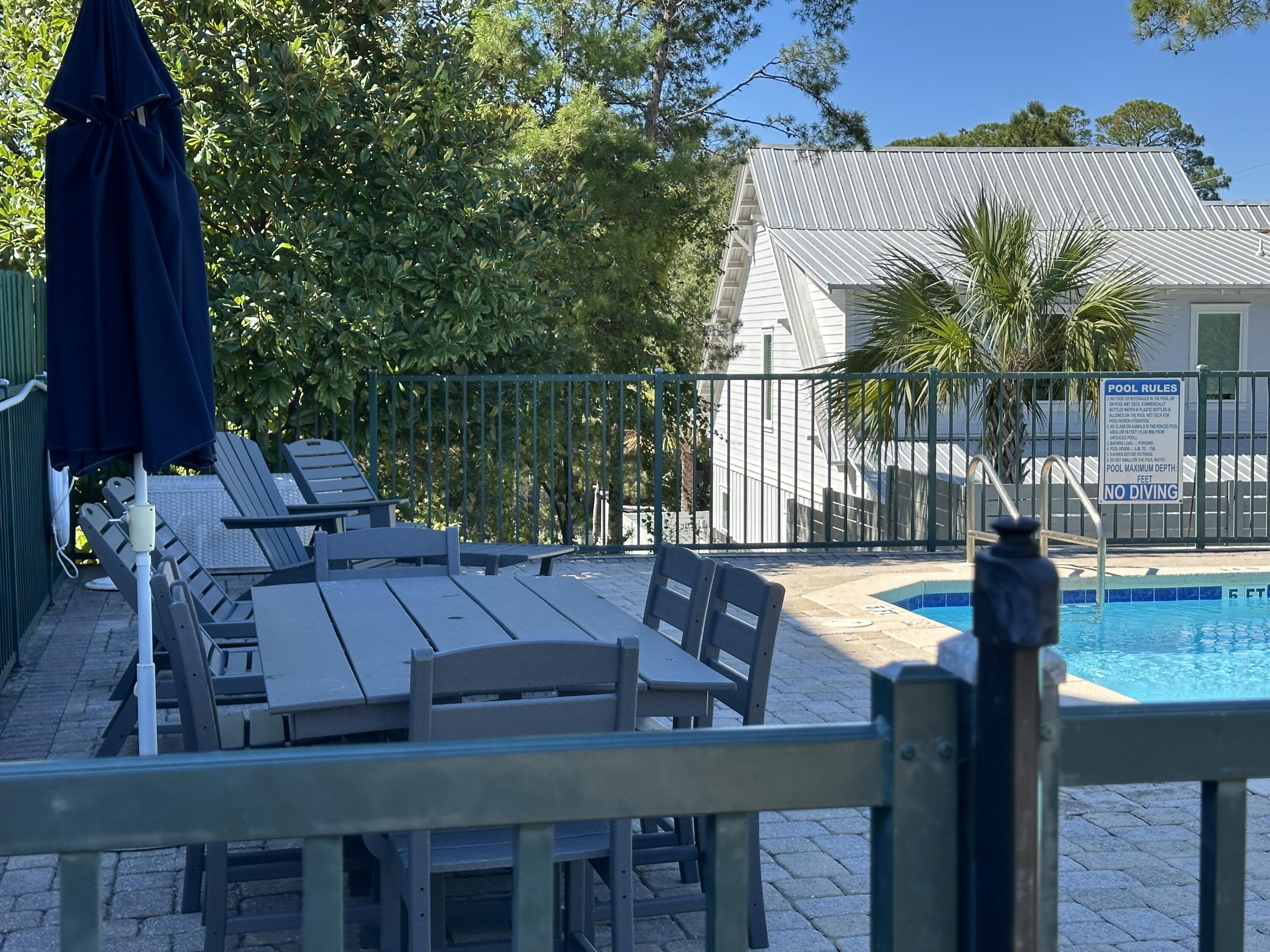 28 Maritime Way Santa Rosa Beach, FL 32459 - Photo 23 of 25 a view of swimming pool with outdoor seating and plants