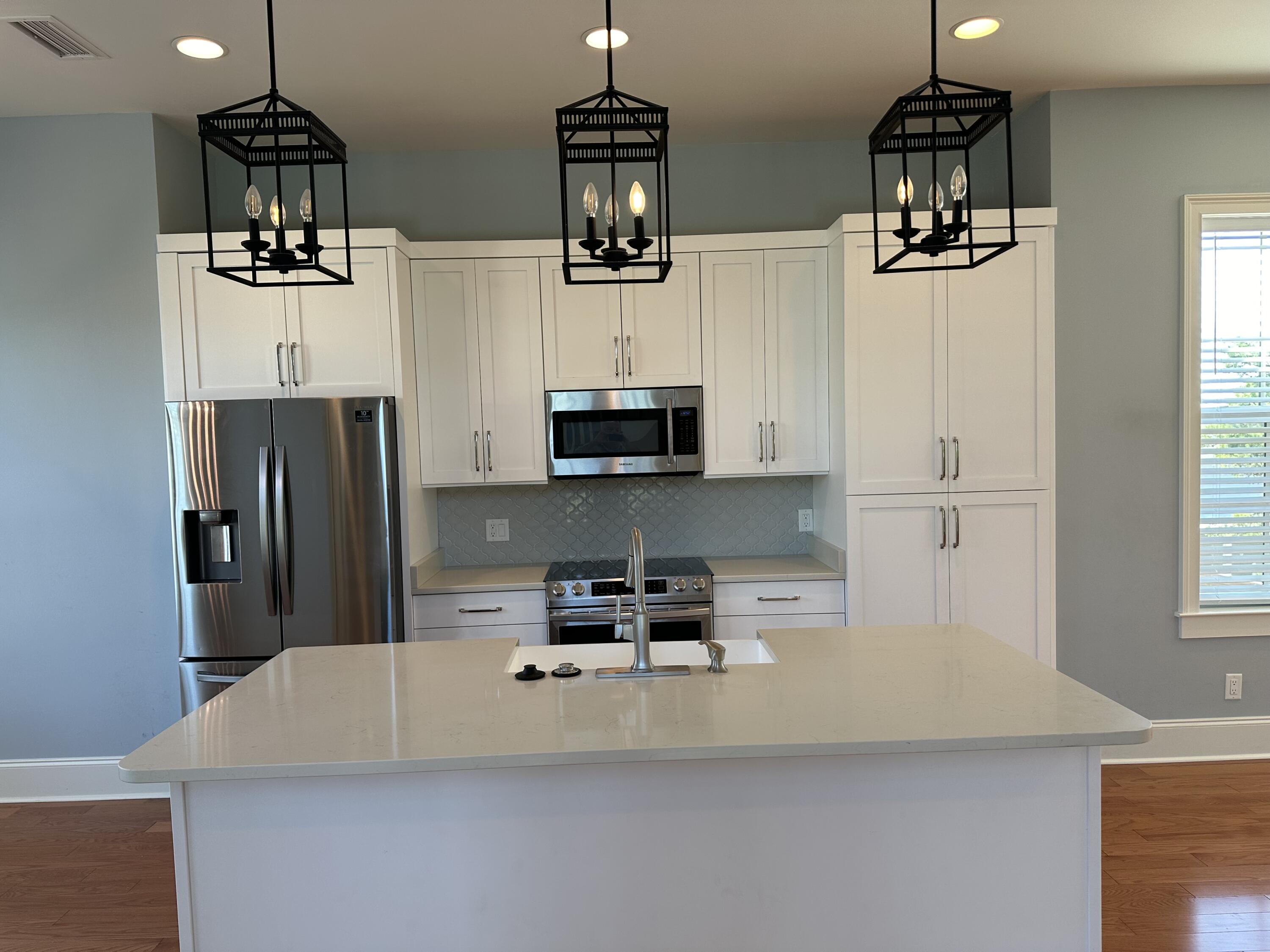 28 Maritime Way Santa Rosa Beach, FL 32459 - Photo 3 of 25 a kitchen with stainless steel appliances a refrigerator and microwave