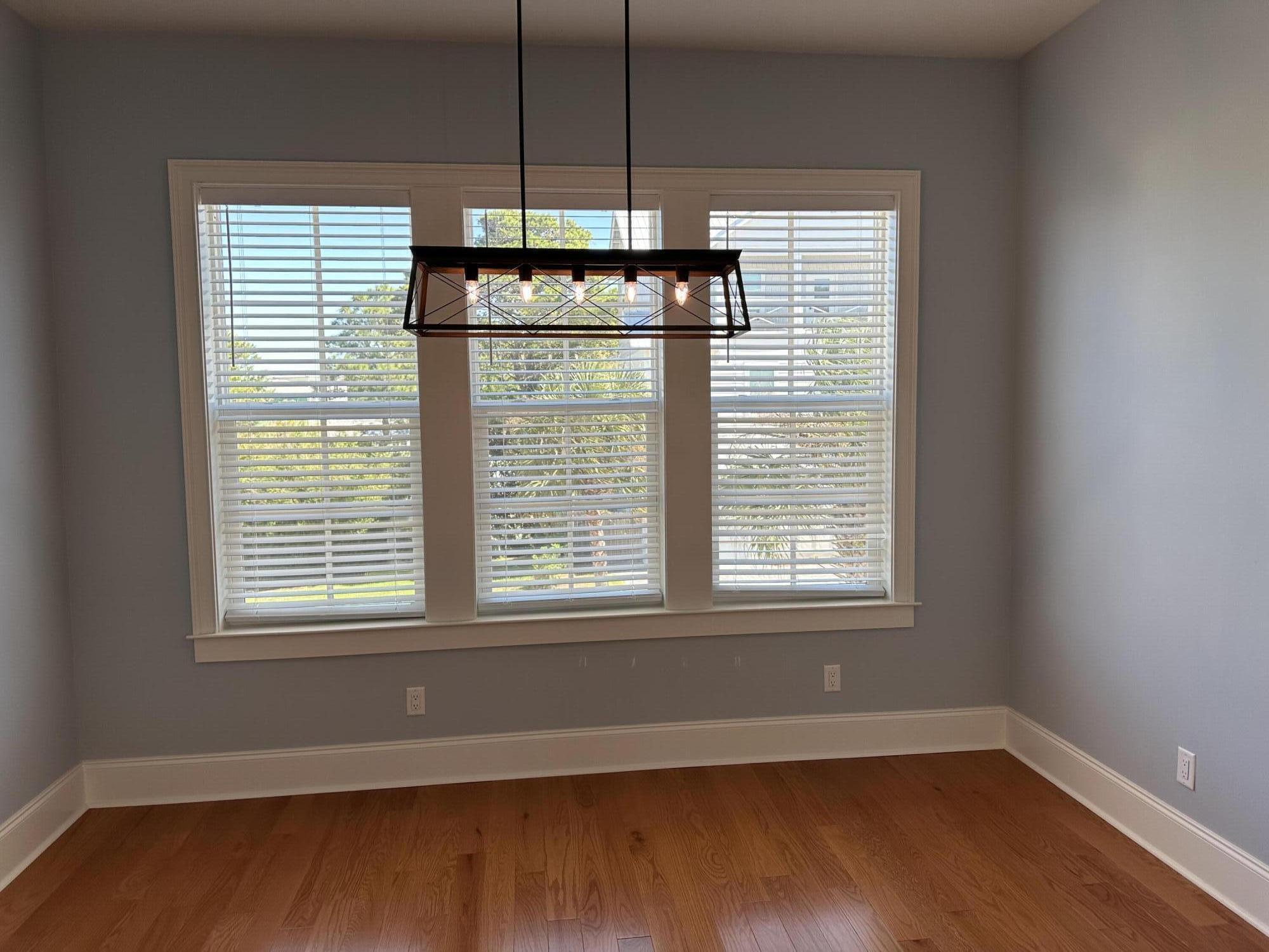 28 Maritime Way Santa Rosa Beach, FL 32459 - Photo 4 of 25 a view of an empty room with wooden floor and a window