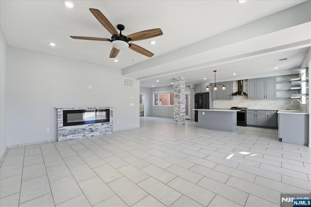 85 Beckwith Place, Unit 1 Rutherford, NJ 07070 - Photo 13 of 20 a view of kitchen with microwave and cabinets