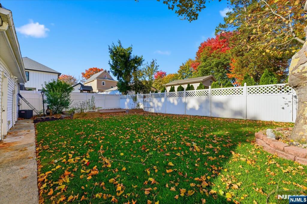 85 Beckwith Place, Unit 1 Rutherford, NJ 07070 - Photo 17 of 20 a view of house with outdoor space and garden