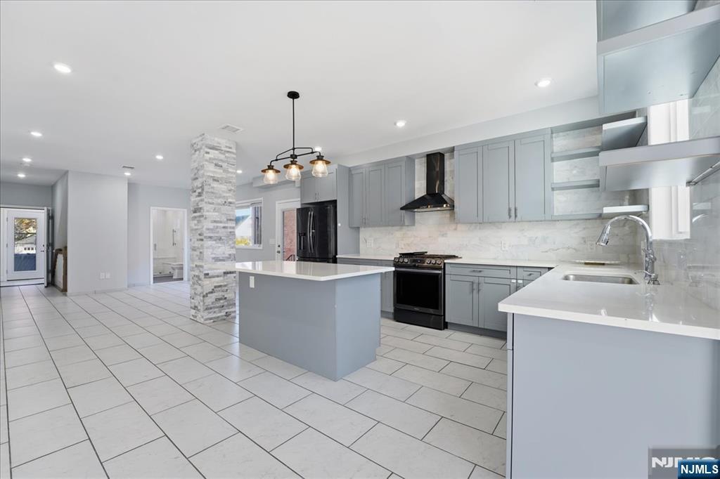 85 Beckwith Place, Unit 1 Rutherford, NJ 07070 - Photo 6 of 20 a kitchen with a sink and cabinets