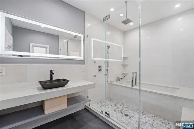 a bathroom with a sink and a mirror