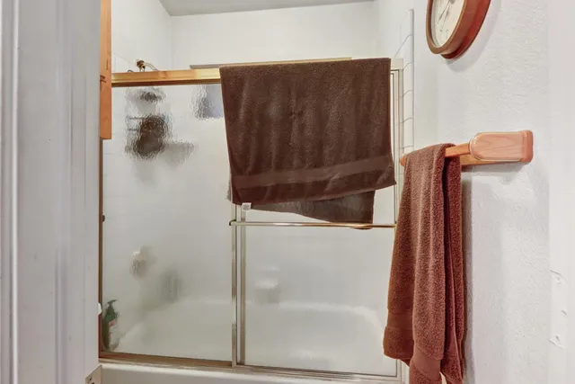 a living room with furniture and air hockey table
