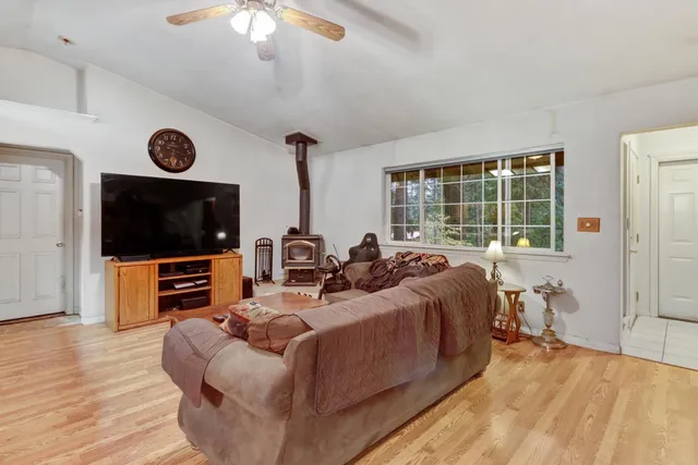 a bedroom with furniture and a window