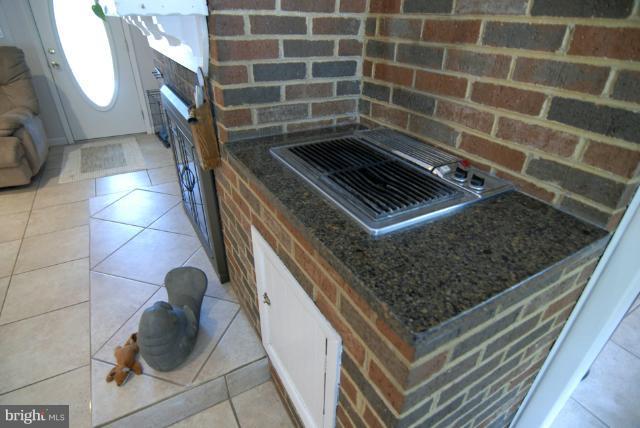 13761 Notley Road Silver Spring, MD 20904 - Photo 14 of 30 Grill at fireplace in family room