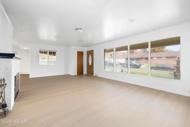 a view of an empty room with a window