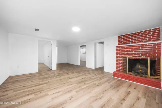 a view of fireplace and wooden floor