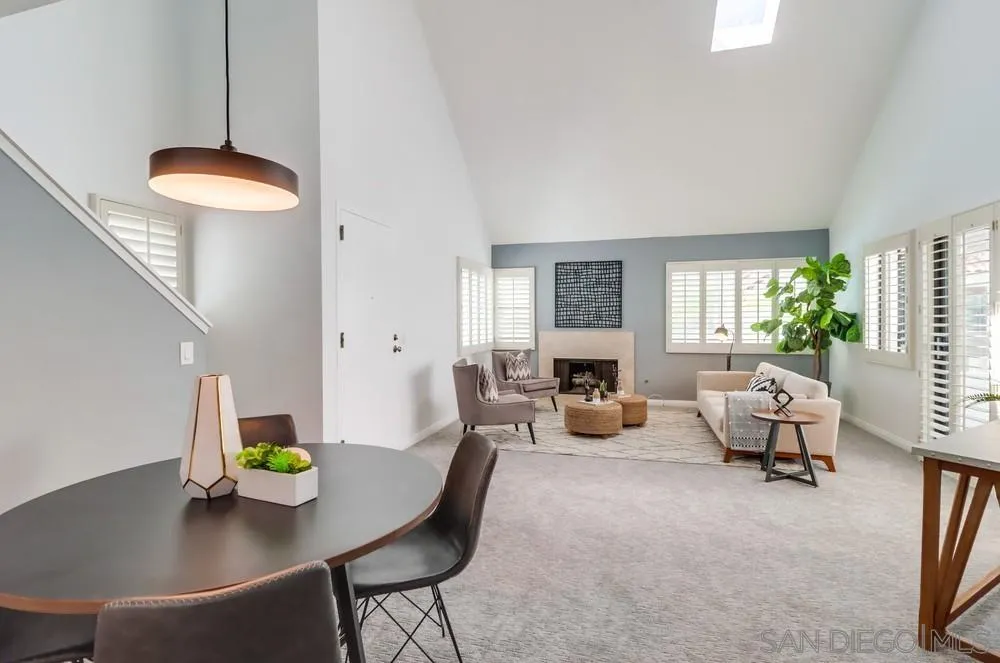 701 Kettner Boulevard, Unit 70 San Diego, CA 92101 - Photo 14 of 31 a living room with furniture and a chandelier