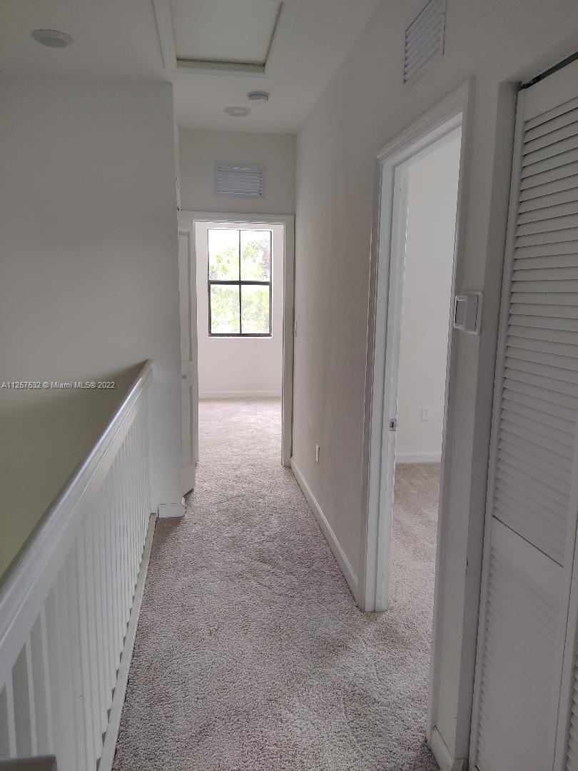 18232 Southwest 148th Road Miami, FL 33187 - Photo 16 of 32 a view of hallway with windows