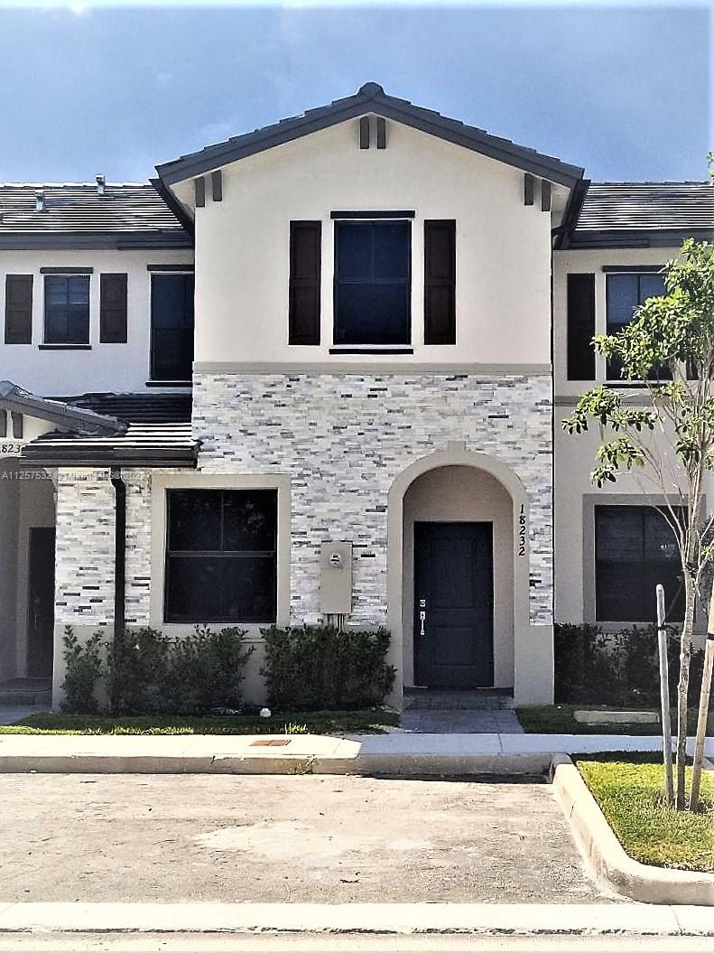 18232 Southwest 148th Road Miami, FL 33187 - Photo 32 of 32 a front view of a house with yard
