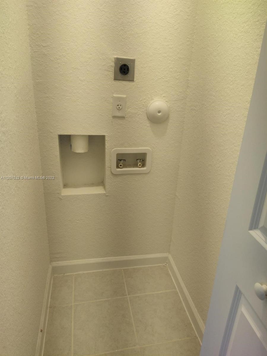 18232 Southwest 148th Road Miami, FL 33187 - Photo 8 of 32 a bathroom with a shower