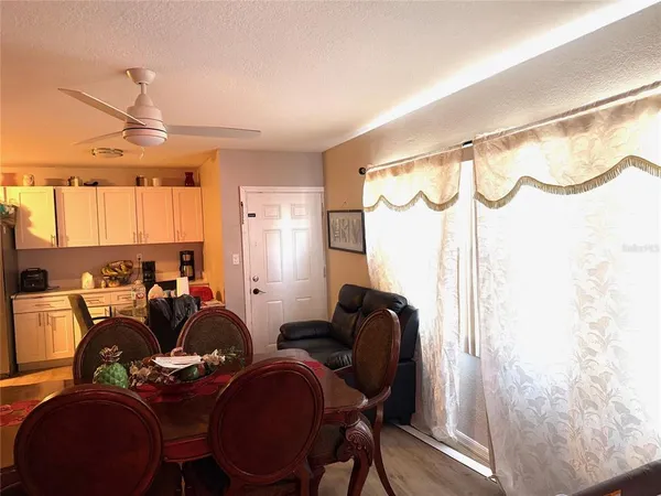 a view of a dining room with furniture window and wooden floor