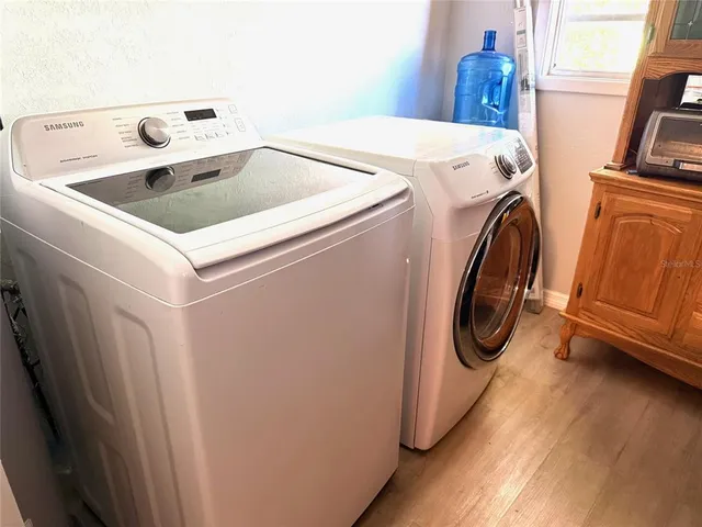 a utility room with dryer and washer