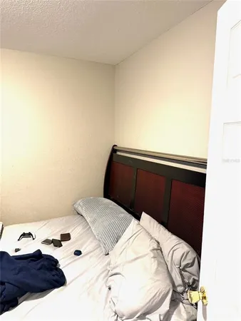 a bedroom with a bed and a cabinets