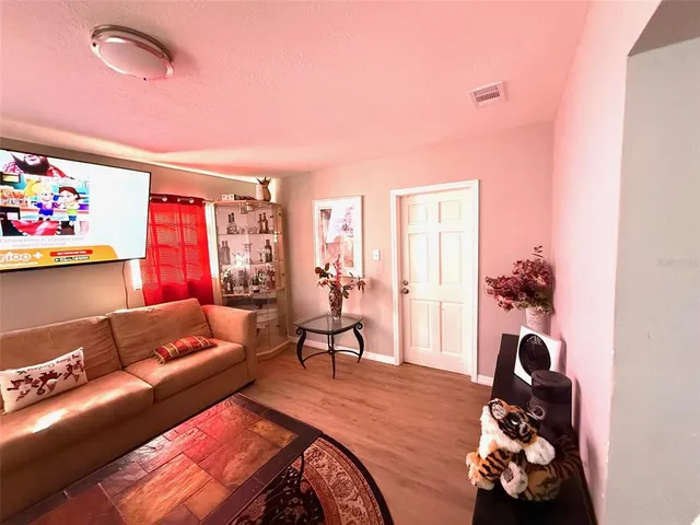 a living room with furniture and a window