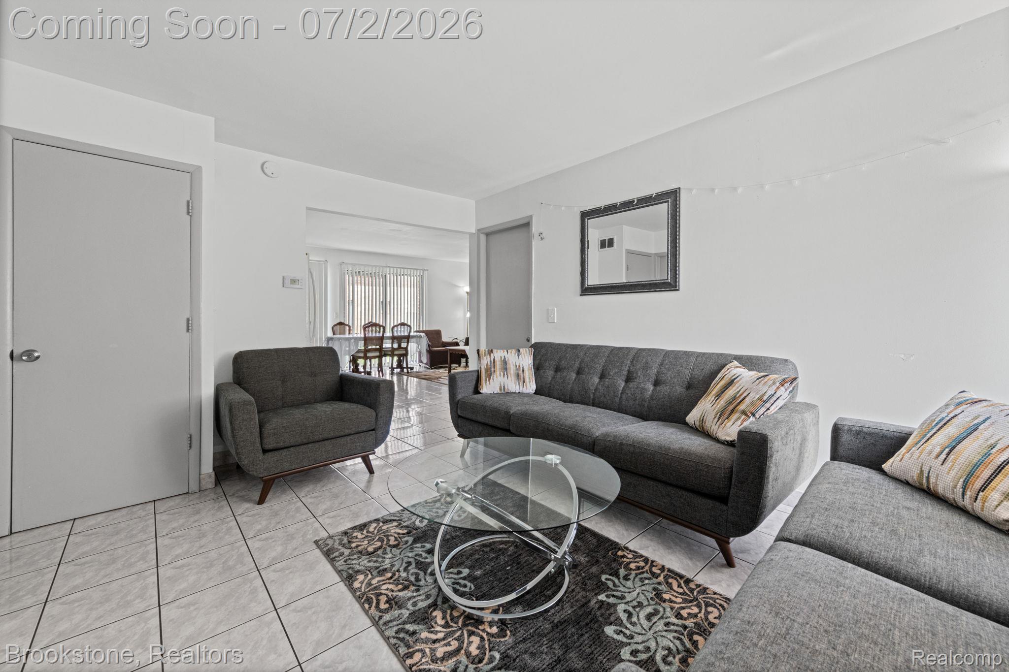 1925 Nicholas Court Warren, MI 48092 - Photo 7 of 26 Neutral white walls complement the light-toned tile flooring