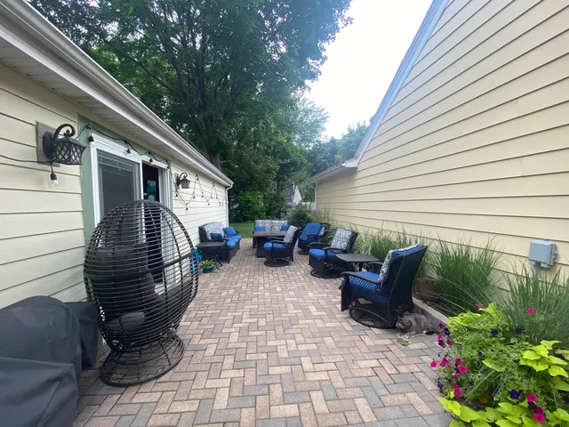 a backyard of a house with seating space