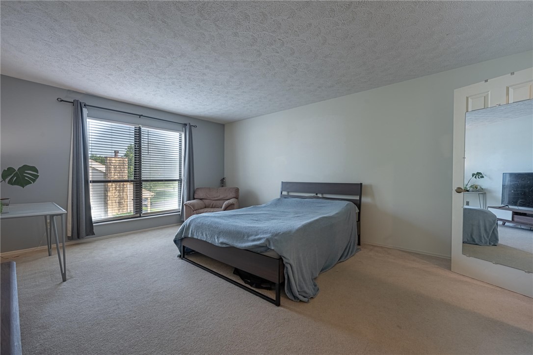 5399 Country Ridge Drive Mason, OH 45040 - Photo 21 of 29 This spacious bedroom offers ample natural light and a serene atmosphere.