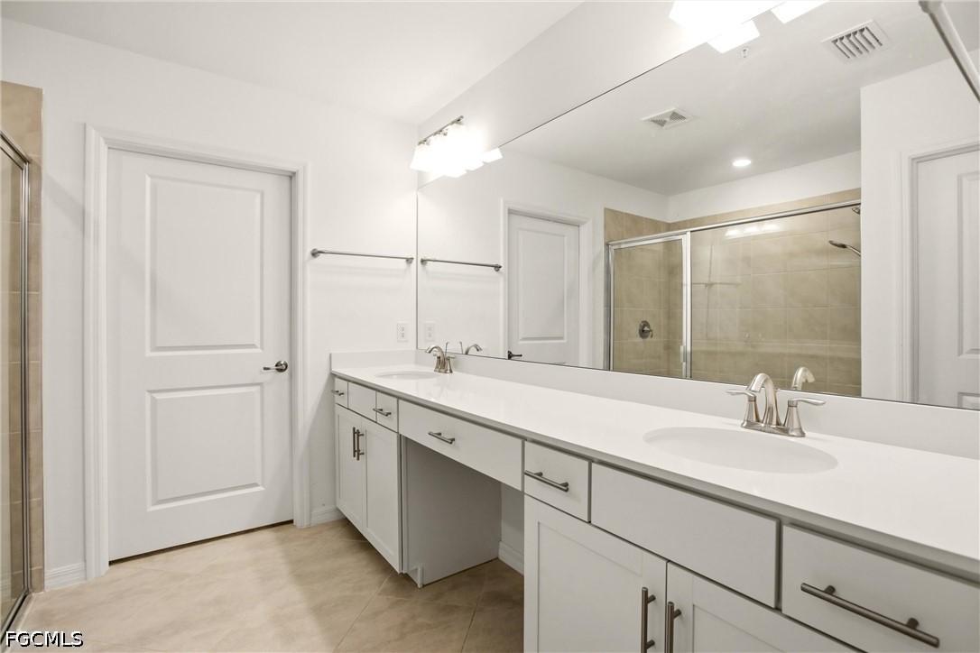 3751 Pebblebrook Ridge Court, Unit 101 Fort Myers, FL 33905 - Photo 30 of 48 a bathroom with a sink and a mirror