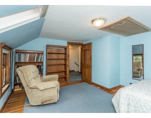 1380 Trapelo Road Waltham, MA 02451 - Photo 20 of 31 a bedroom with a bed and a couch