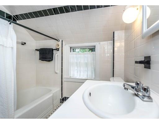 1380 Trapelo Road Waltham, MA 02451 - Photo 26 of 31 a bathroom with a tub a sink and a mirror