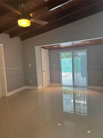 a bathroom with a sink a toilet a mirror and shower