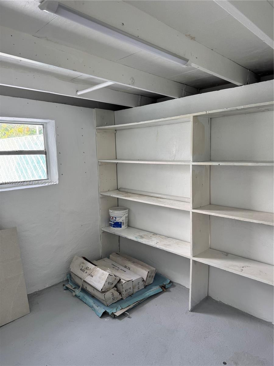 881 Hialeah Drive Hialeah, FL 33010 - Photo 31 of 36 a room with a wooden floor and a window