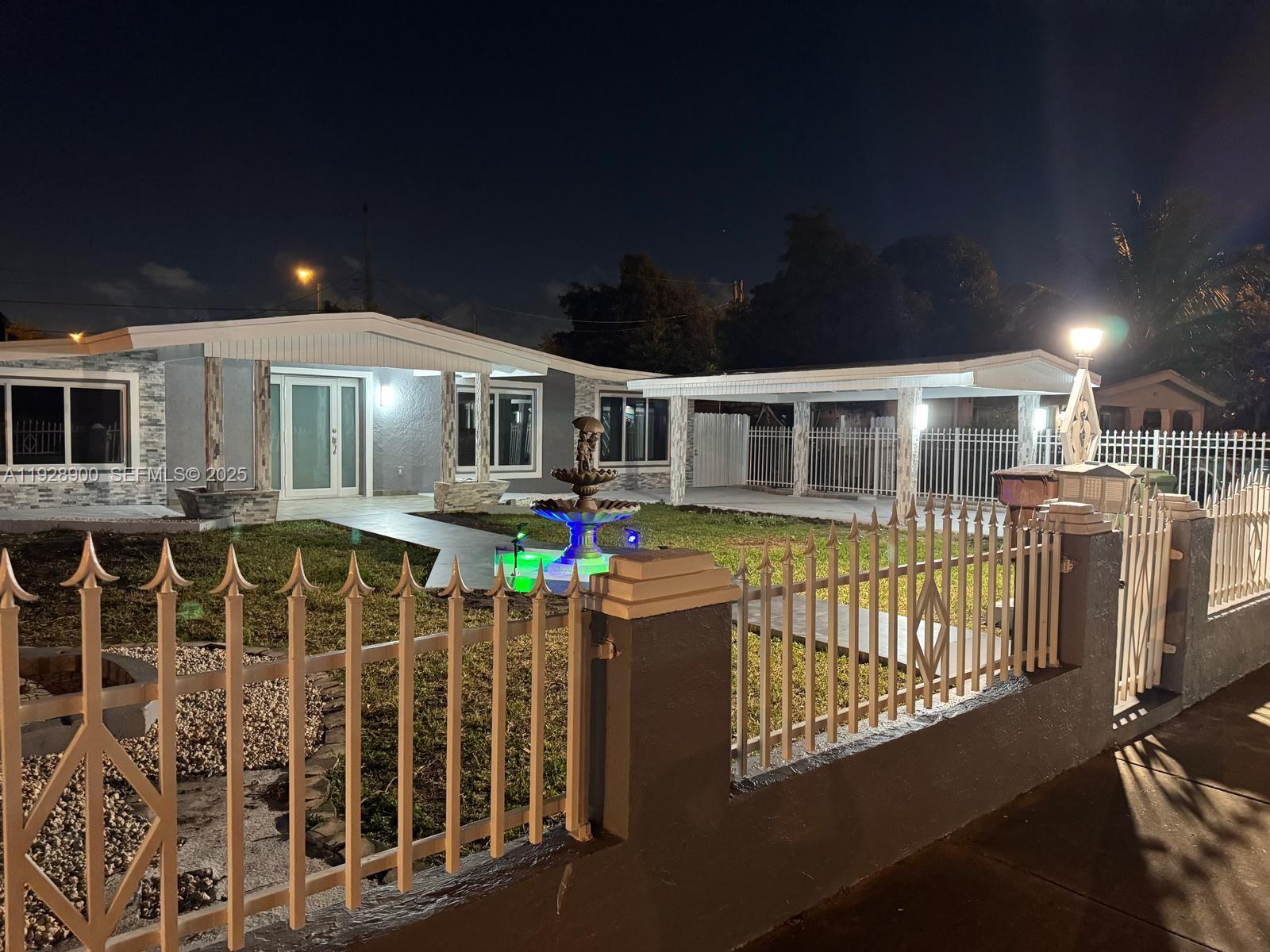 881 Hialeah Drive Hialeah, FL 33010 - Photo 35 of 36 a front view of a house with a yard