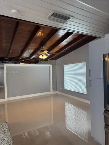 a view of hall way with furniture