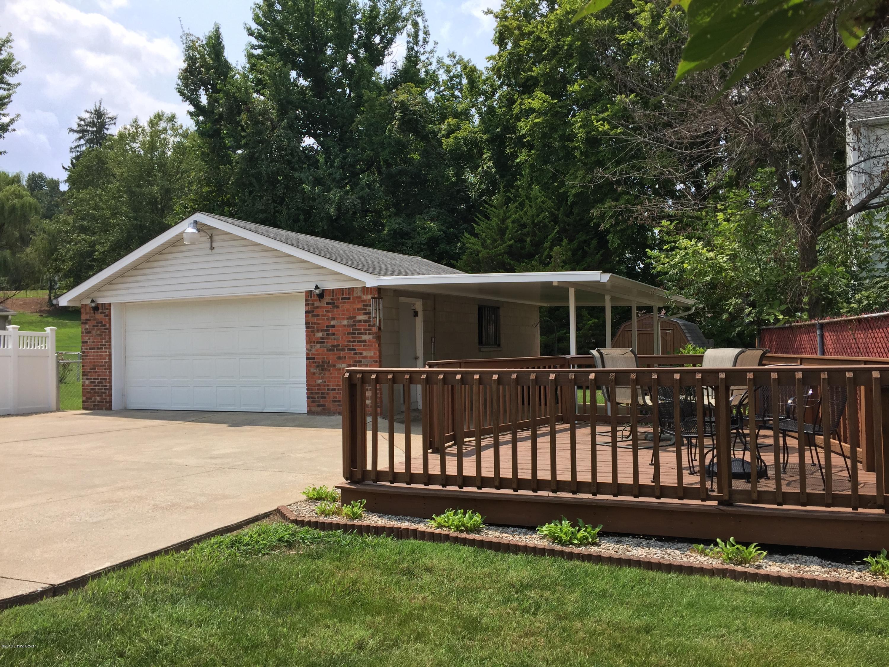 4510 Malcolm Road Louisville, KY 40216 - Photo 29 of 39 Oversized garage keeps all your vehicles protected.