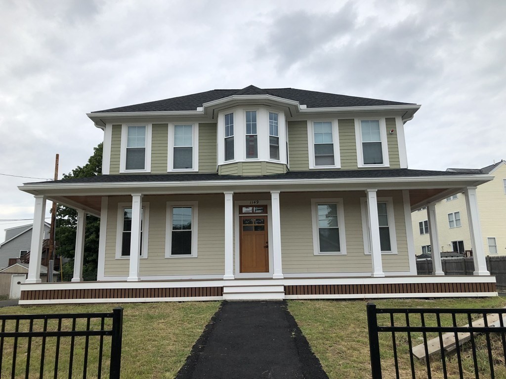 a front view of a house with glass windows
