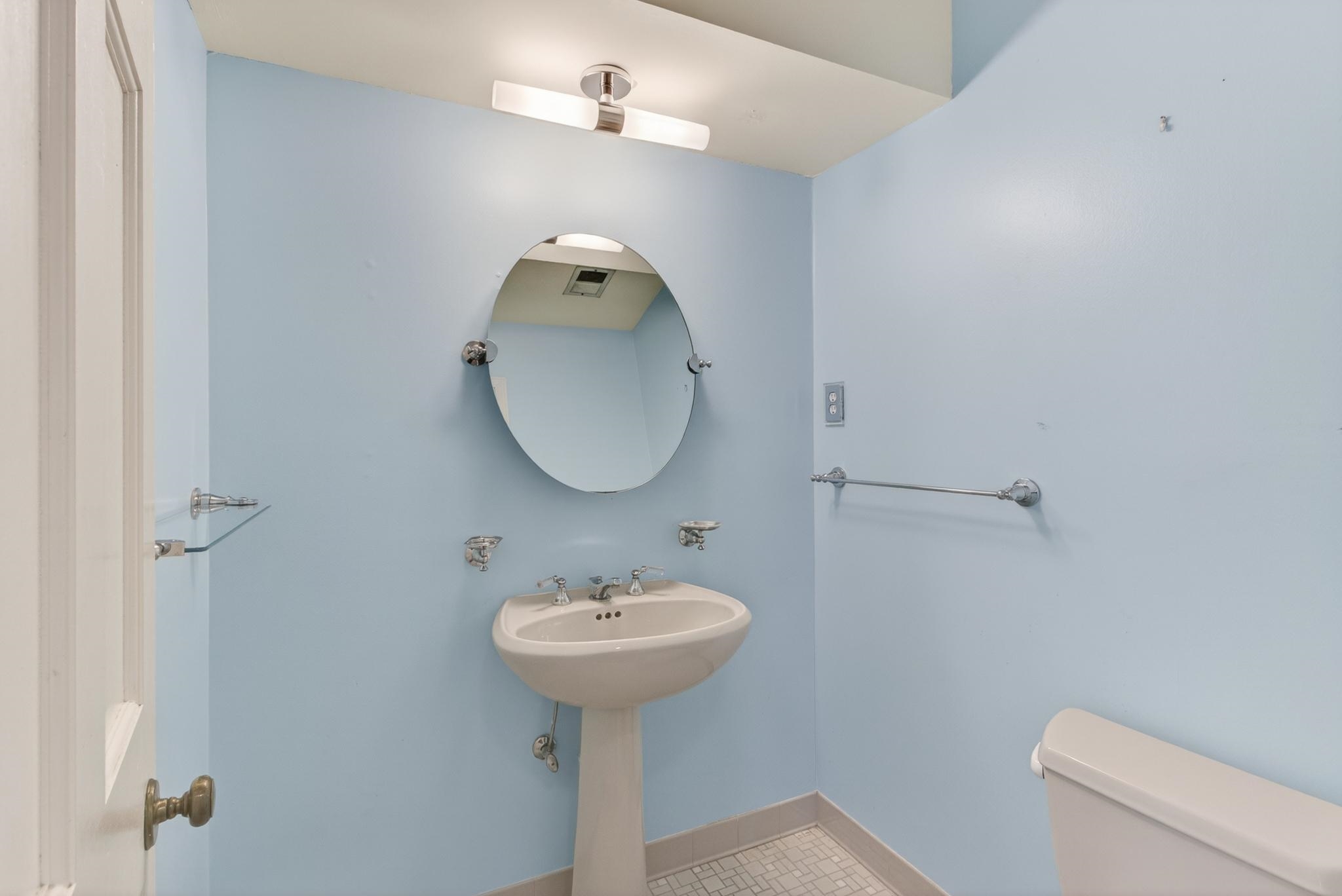 3121 Beechrun Drive Memphis, TN 38128 - Photo 19 of 40 The half bath is thoughtfully placed on the main level of the home, close to the entertainment spaces of the home.