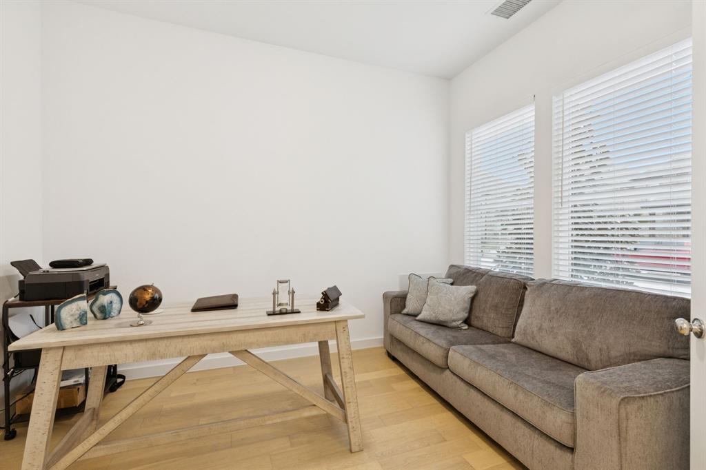 547 Embargo Drive Fate, TX 75189 - Photo 15 of 36 a living room with furniture and a window