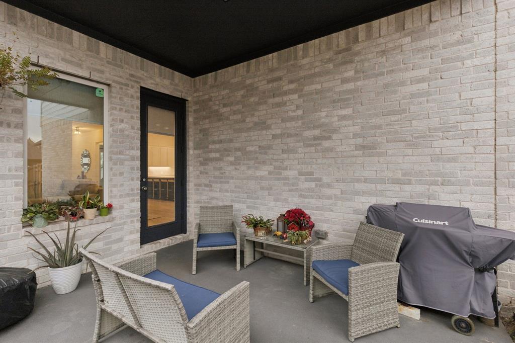 547 Embargo Drive Fate, TX 75189 - Photo 28 of 36 a living room with furniture and a potted plant