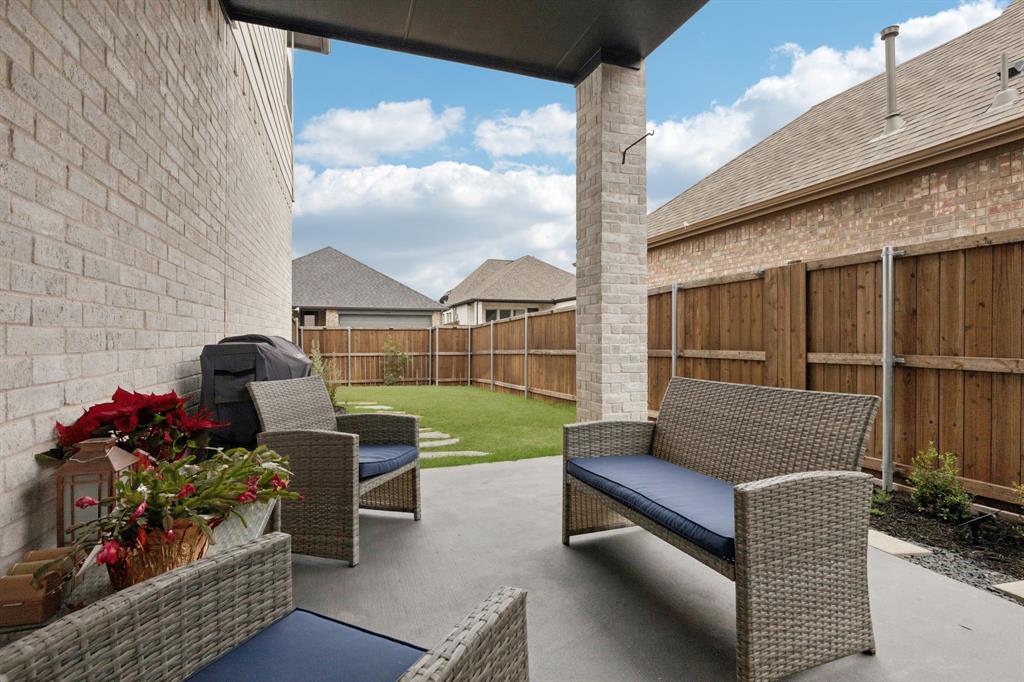 547 Embargo Drive Fate, TX 75189 - Photo 29 of 36 a garden view with a seating space