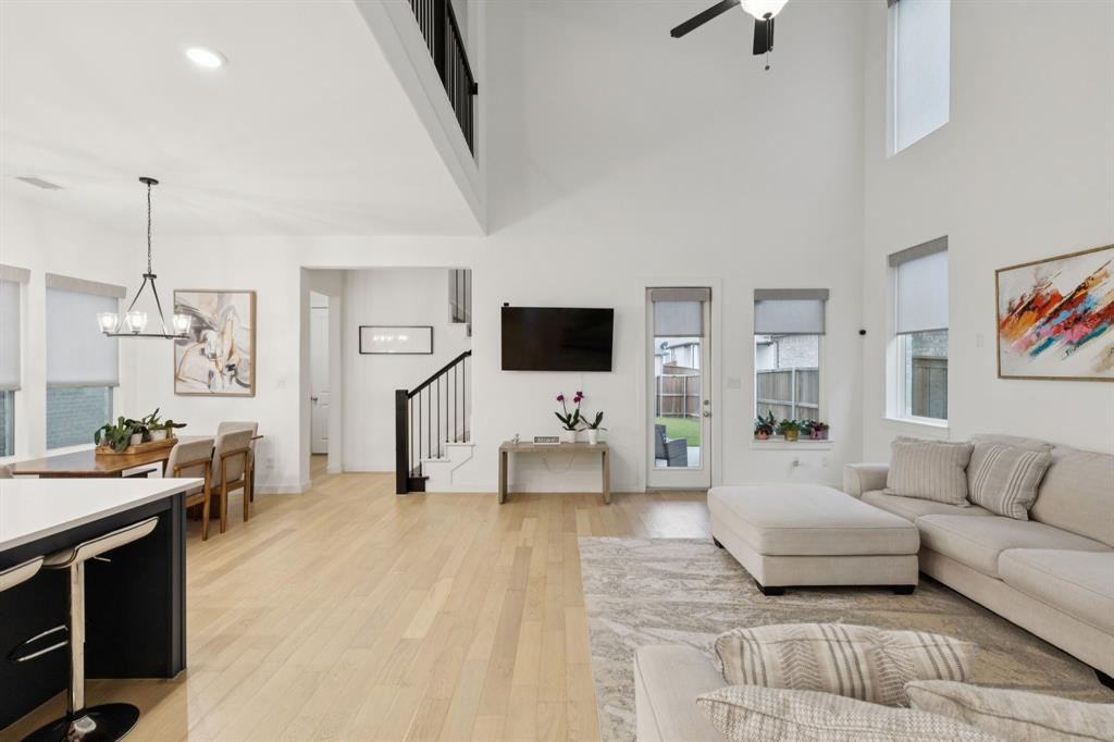547 Embargo Drive Fate, TX 75189 - Photo 6 of 36 a living room with furniture and a flat screen tv