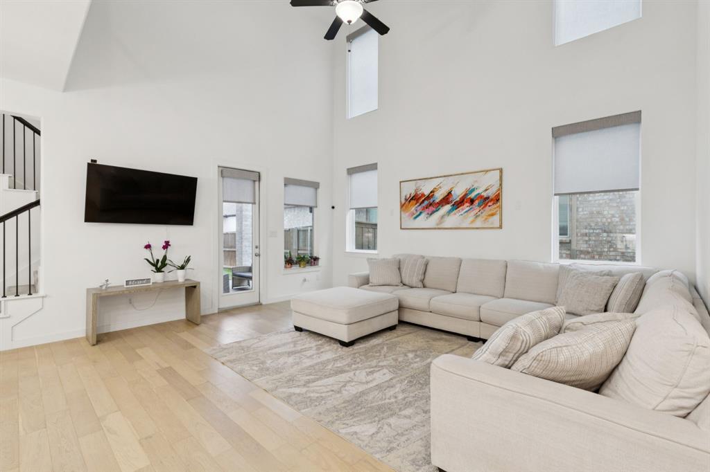 547 Embargo Drive Fate, TX 75189 - Photo 7 of 36 a living room with furniture and a flat screen tv