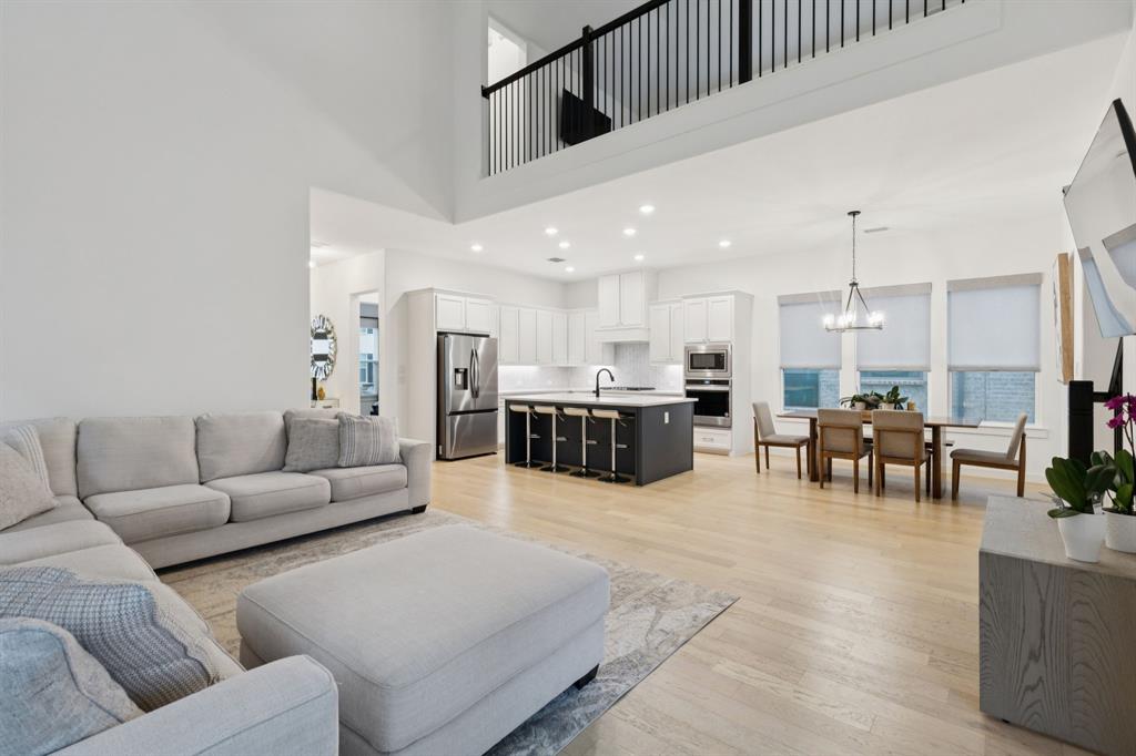 547 Embargo Drive Fate, TX 75189 - Photo 8 of 36 a living room with furniture and kitchen view