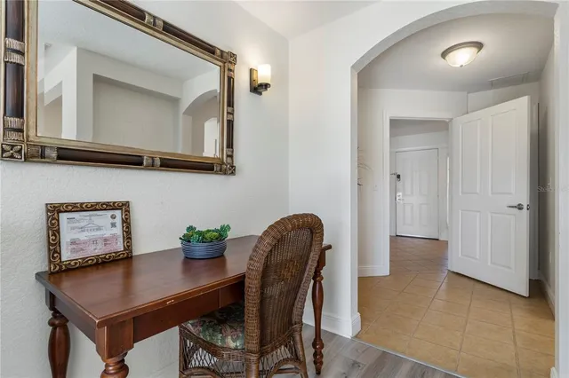 a spacious bedroom with two beds and a large window