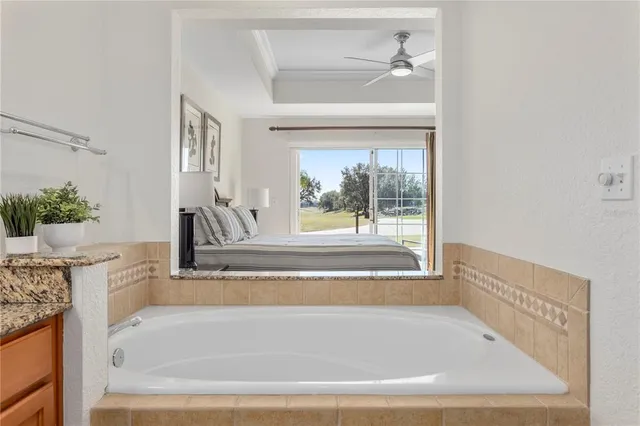 a bathroom with a granite countertop sink mirror and vanity