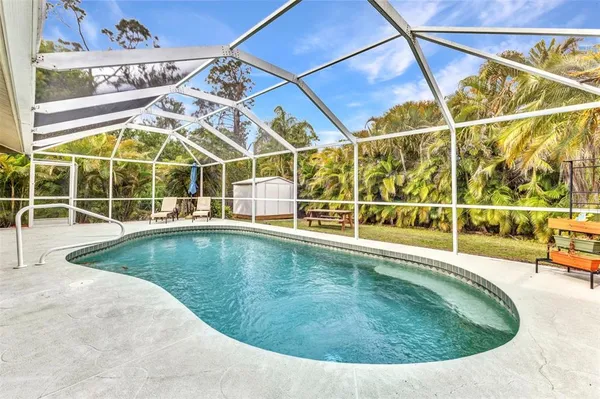 a view of a swimming pool with outdoor space
