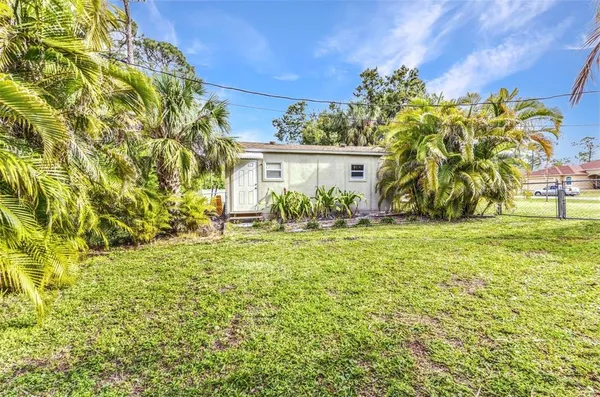 a view of front of a house with a big yard