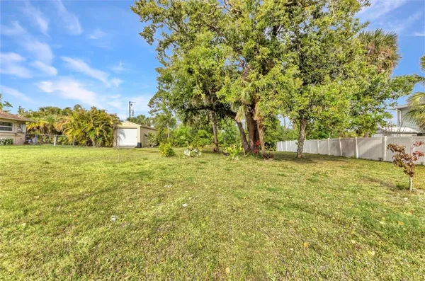 a view of yard with tree and green space